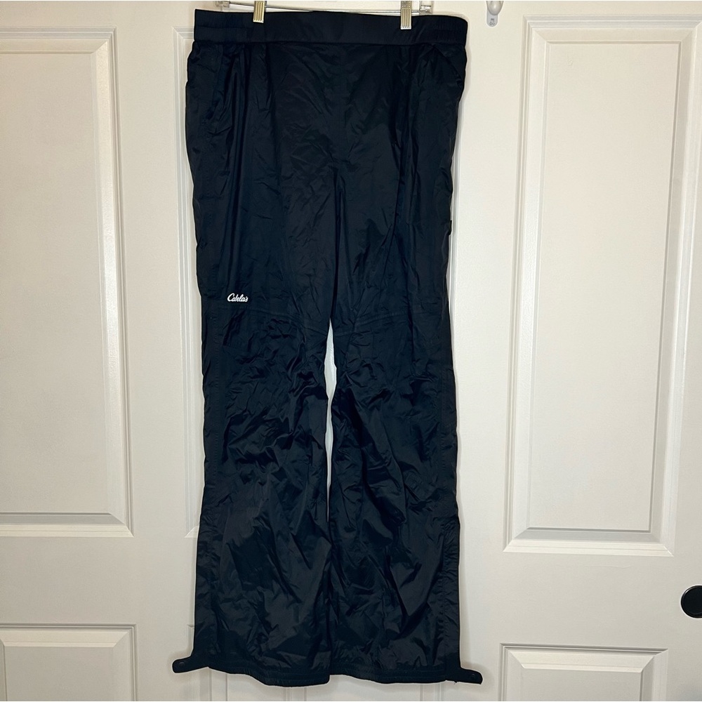 Cabela’s XL nylon black outdoor rain pants. Thin. Ankle zip and snap!